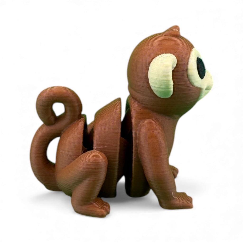 Tiny aapje bruin zijaanzicht met gekrulde staart