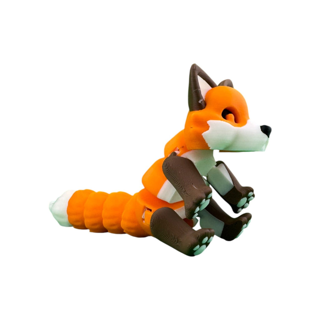 Articulated vos oranje/bruin/wit 14,5 cm languit liggend op zijde op witte achtergrond